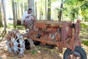 man-driving-an-old-tractor