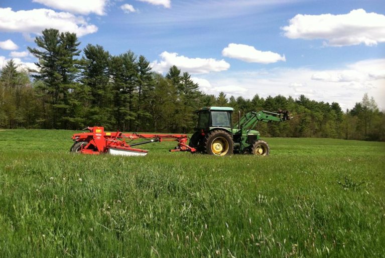 Pinewood Yankee Farm banner, tractor in field