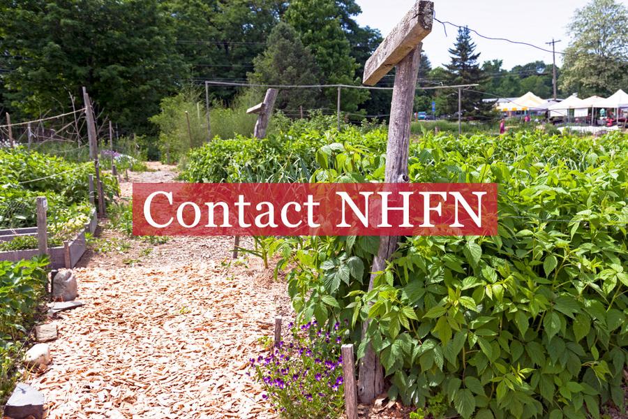 Contact NHFN text overlaying lush garden beds outdoors